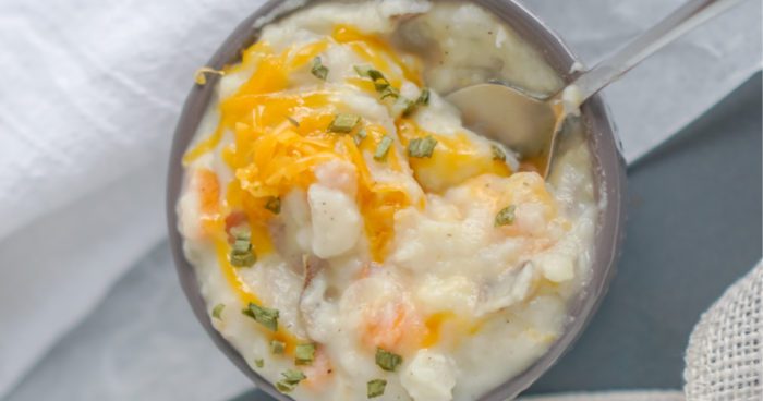 A bowl of cheesy mashed potatoes.