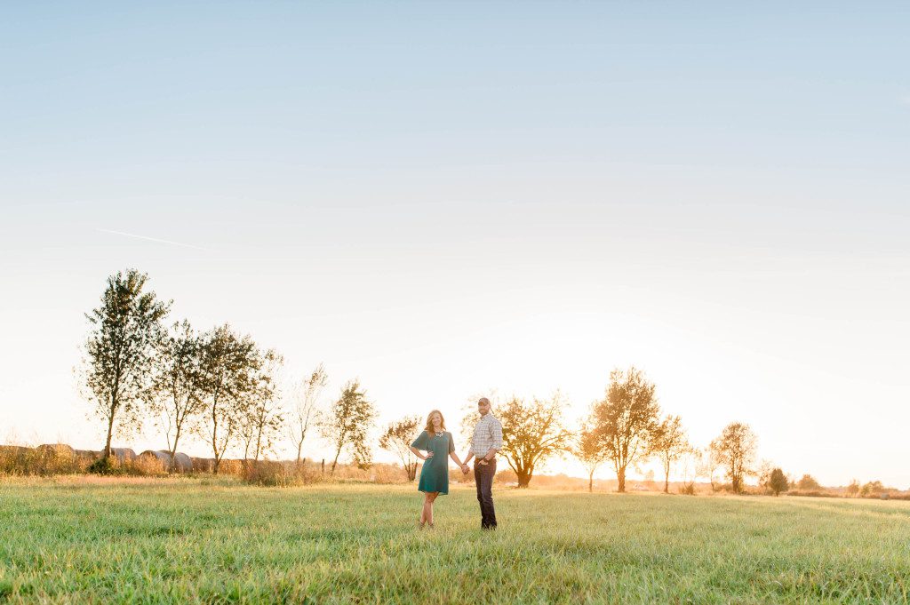 Engagement photos in a field