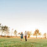 Engagement photos in a field