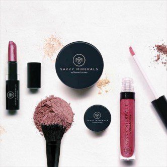 Savannah naturals Young Living Savvy Minerals Makeup products on a white surface.