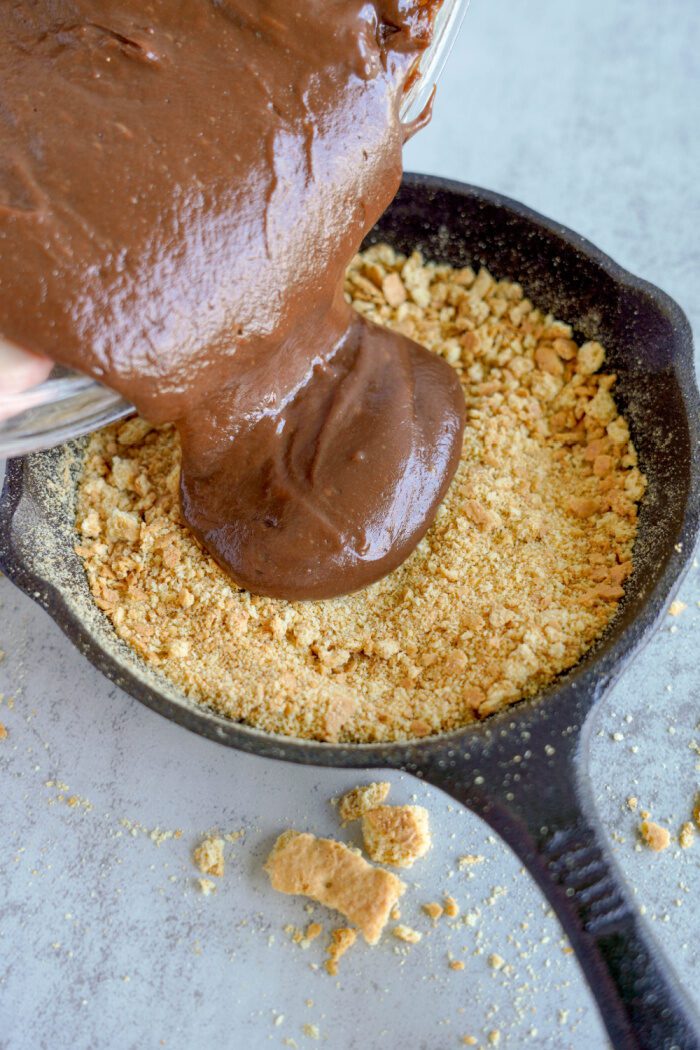 Chocolate S'mores Dip Chocolate Pouring into Skillet