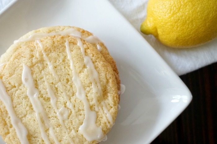 Easy lemon cookies with icing on a white plate.