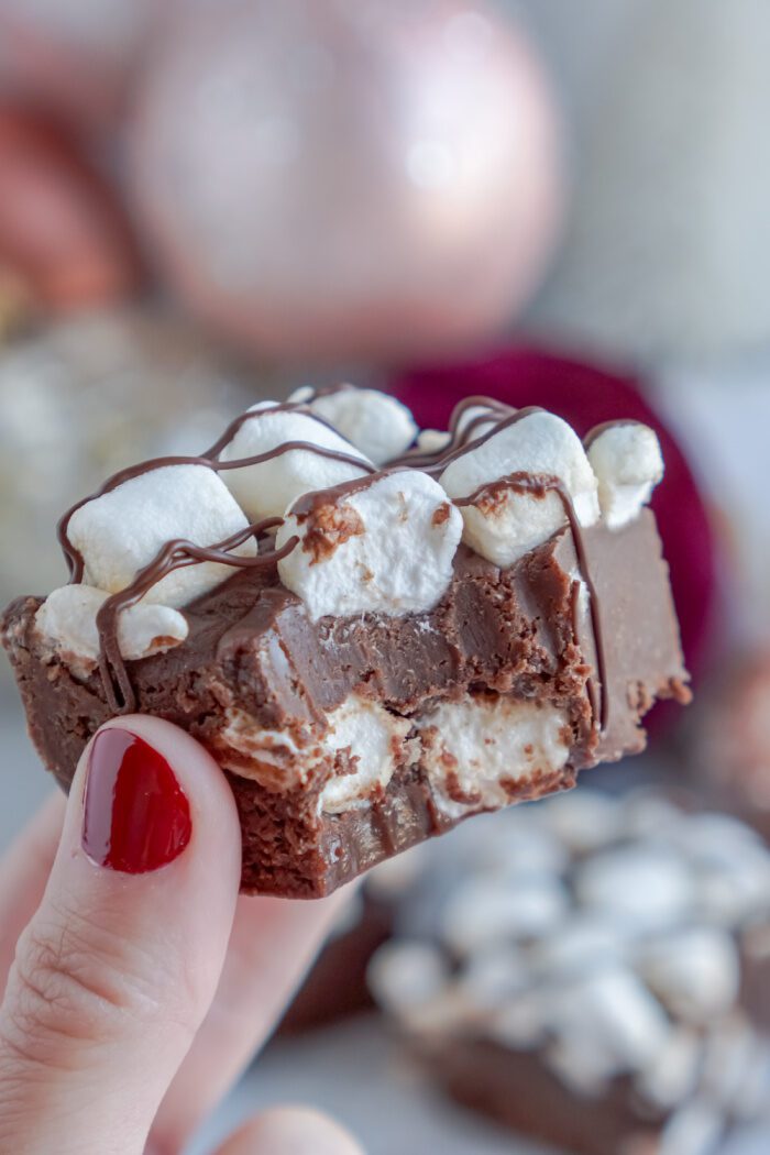 Someone Holding Hot Chocolate Fudge Square