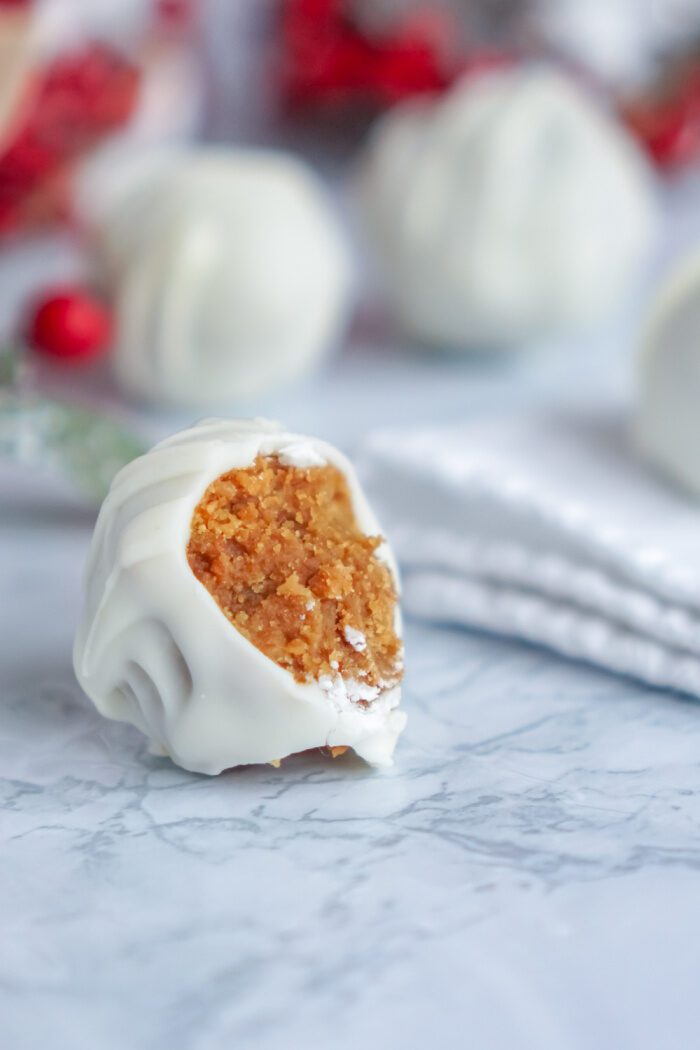 Gingersnap Cheesecake Truffle With a Bite Taken Out