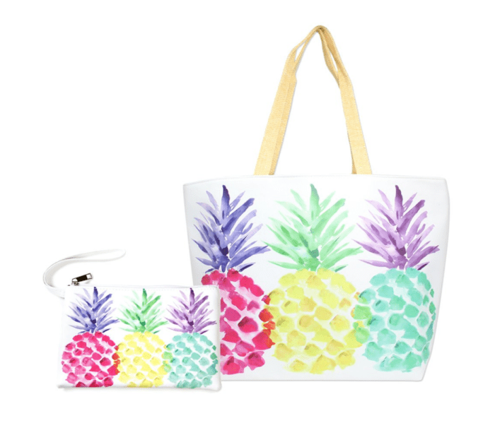 A tote bag with colorful pineapples on it, perfect as one of the 10 amazing beach bags for summer.