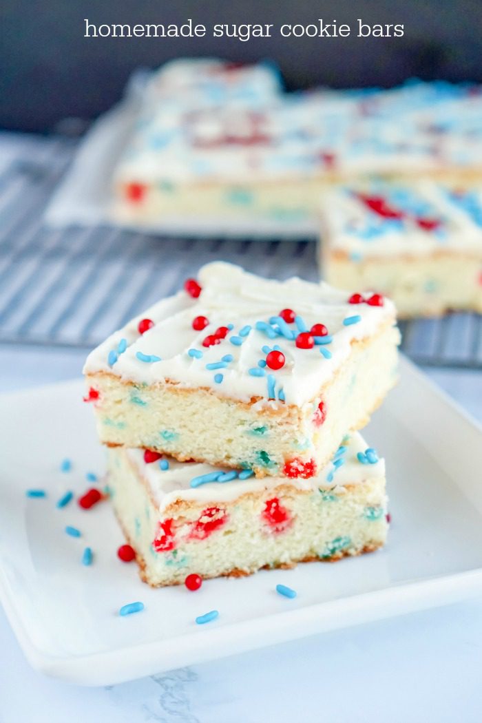 Homemade Sugar Cookie Bars Stacked on a White Plate for 4th of July