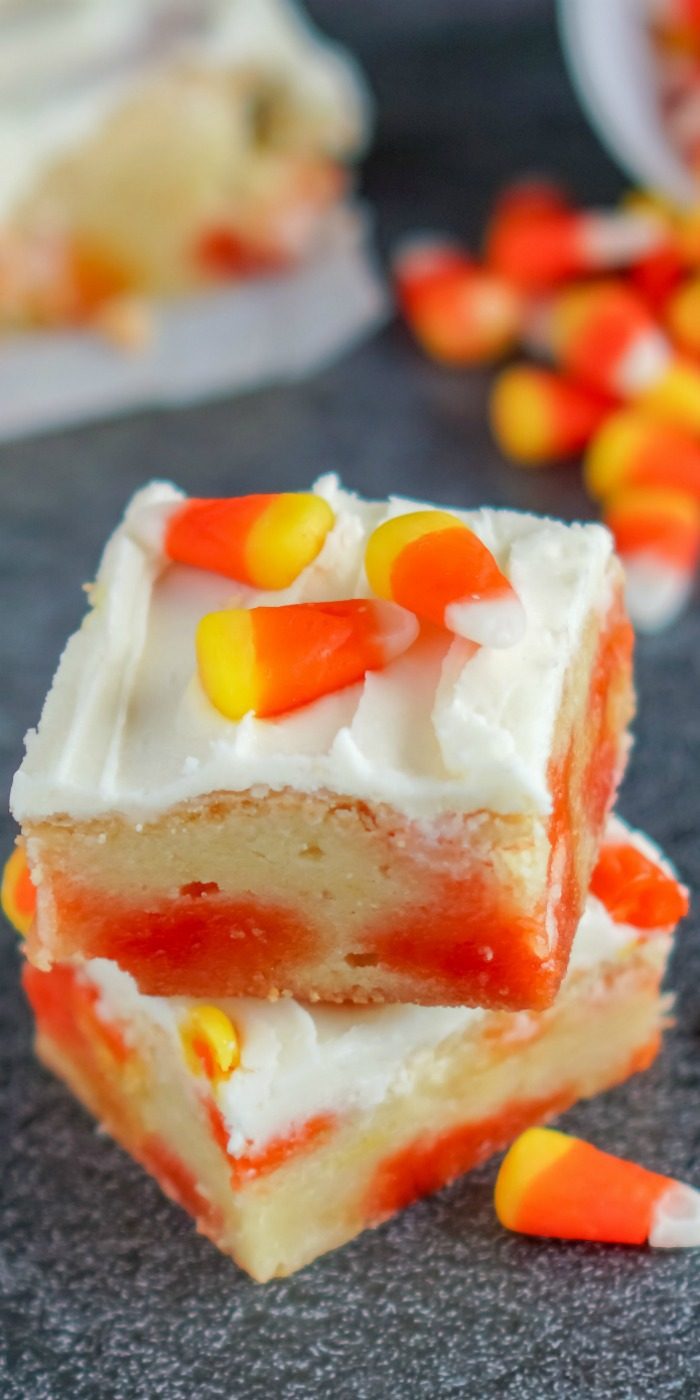 A stack of Candy Corn Cookie Bars stacked on top of each other for Halloween.