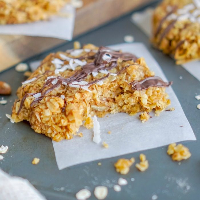 A close-up of a half-eaten oatmeal cookie.