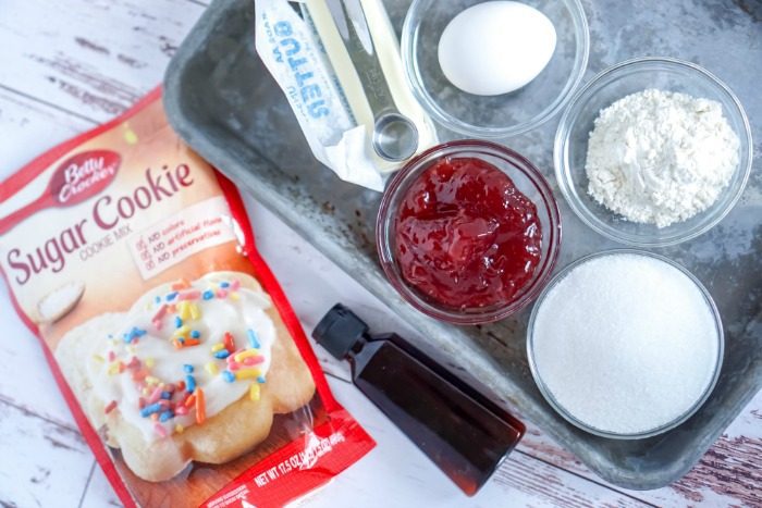 Christmas sugar cookie ingredients on a tray.