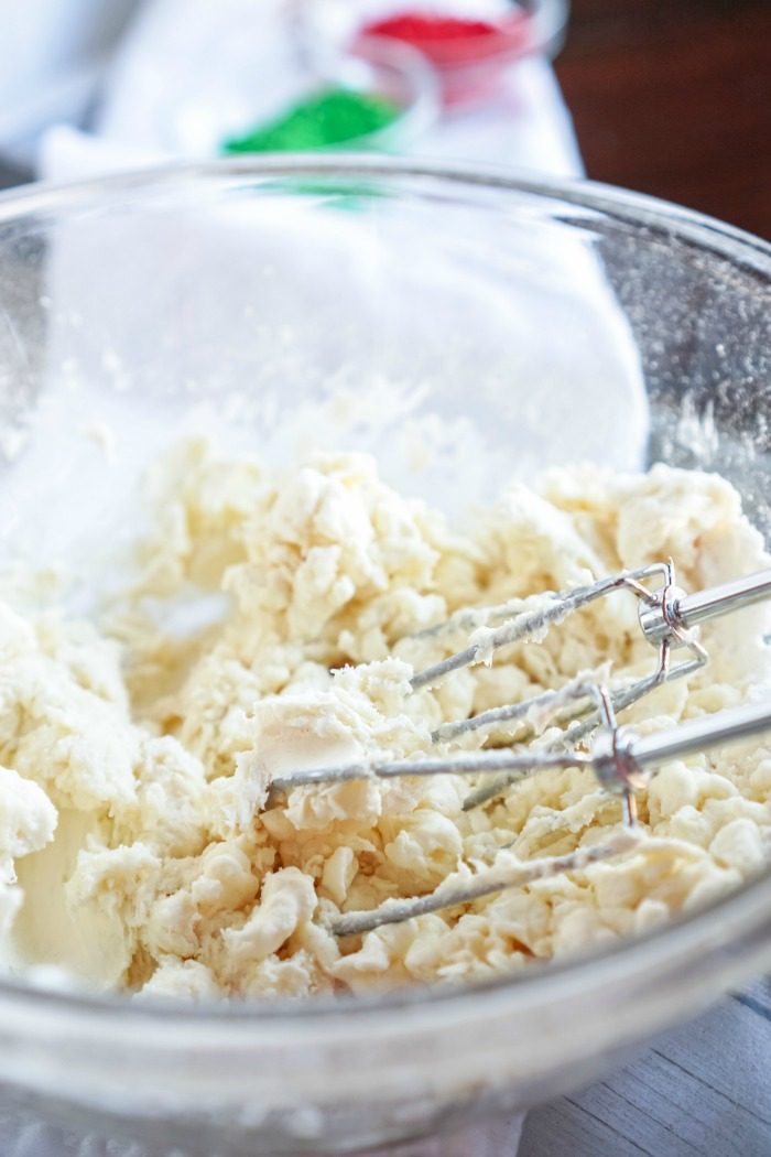 A bowl of Sugar Cookie Dough Dip with a whisk in it, perfect for Christmas.