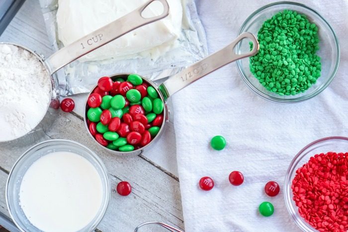 Christmas sugar cookie dough dip with m&m's and candy canes.