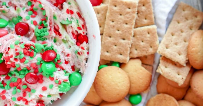 A bowl full of Christmas sugar cookies and crackers.