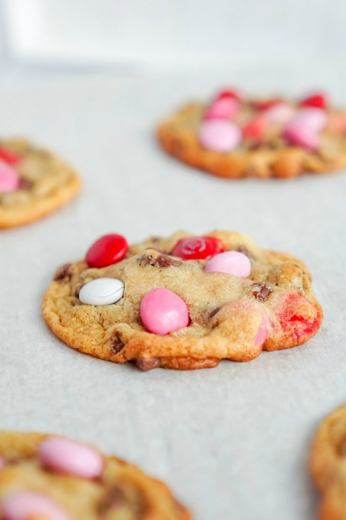 Valentine's day best M&M cookies on a baking sheet.