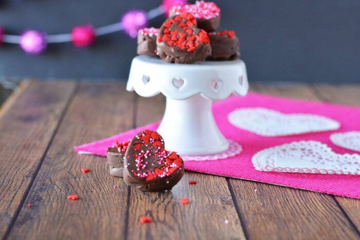 Easy Valentine's Day chocolate truffles on a pink tablecloth.