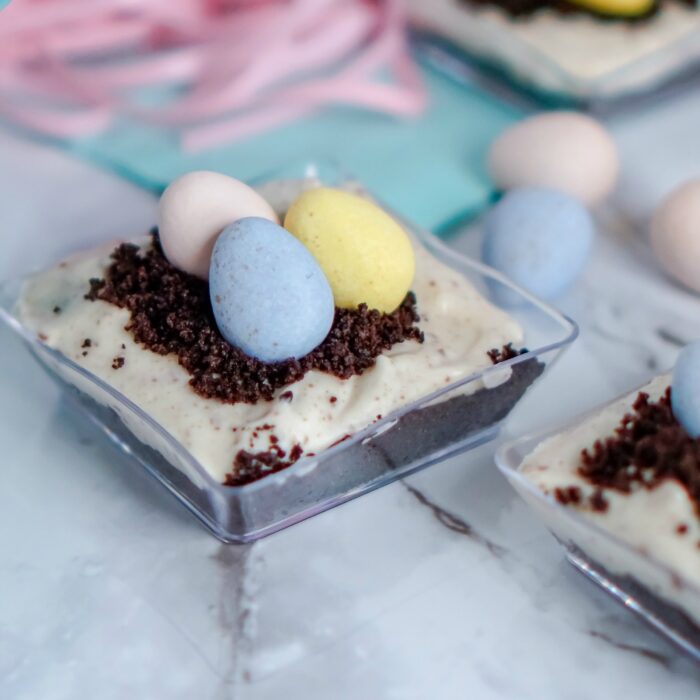 Chocolate Easter eggs in a nest featuring a No Bake Mini Cheesecake Recipe.