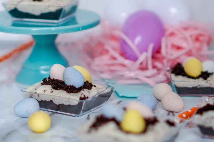 Easter No Bake Mini Cheesecake desserts in small bowls with easter eggs.