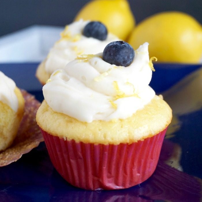 Amazing Lemon cupcakes with blueberries and icing.