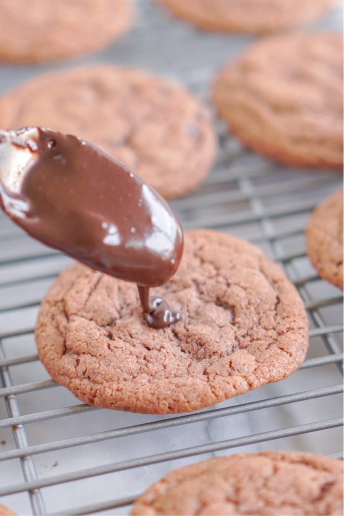 Chocolate chip cookie with chocolate syrup.