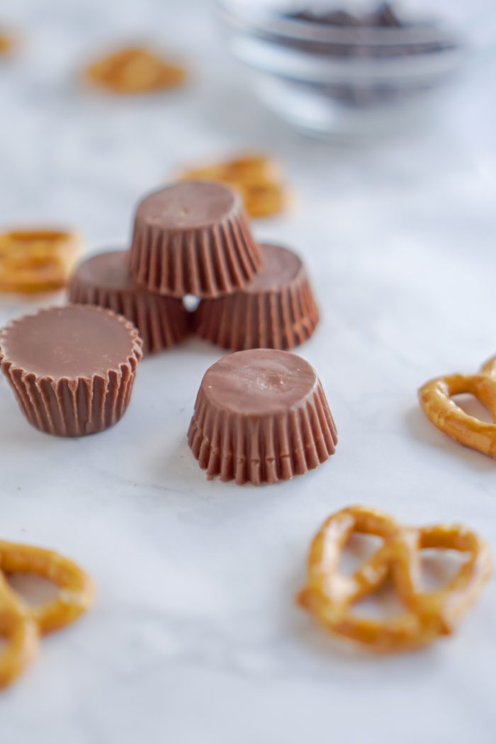 Mini chocolate peanut butter cups and pretzels.