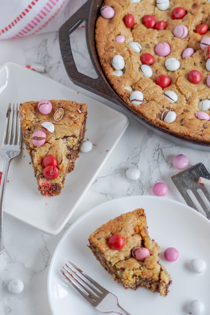 A skillet chocolate chip cookie with Valentine's Day M&Ms.