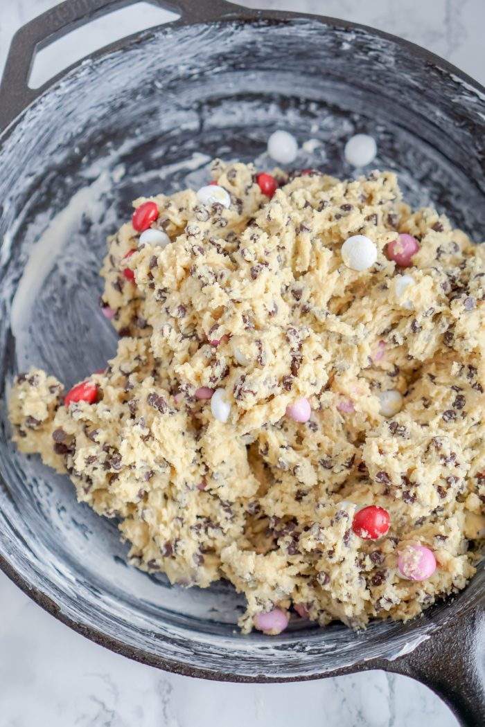 A skillet of chocolate chip cookie dough.