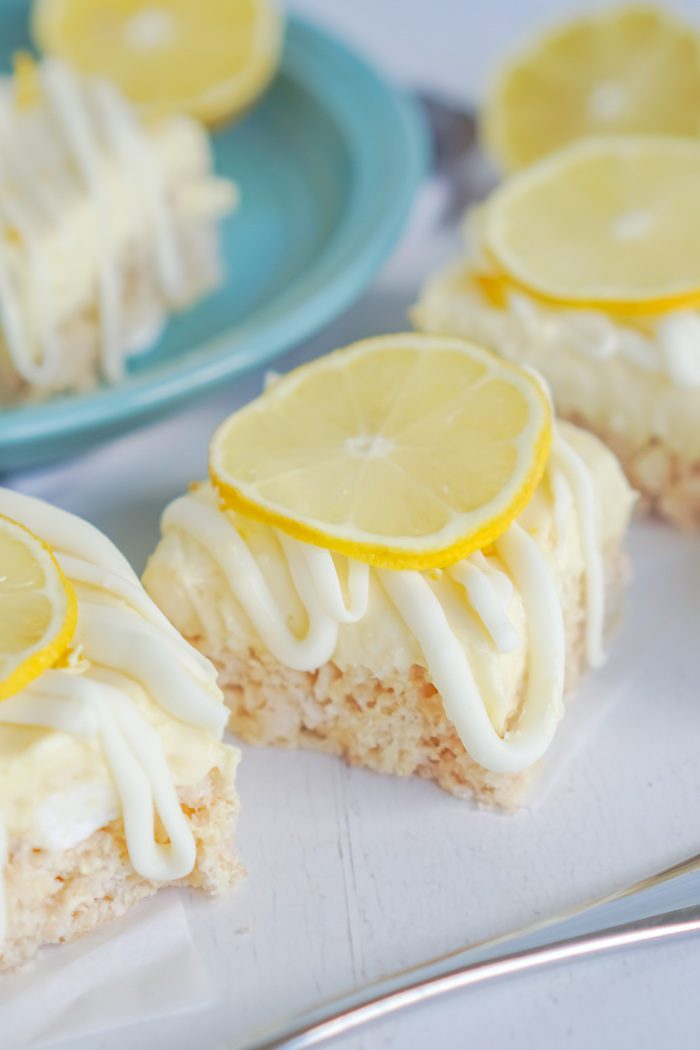 Lemon squares with lemon slices on top.