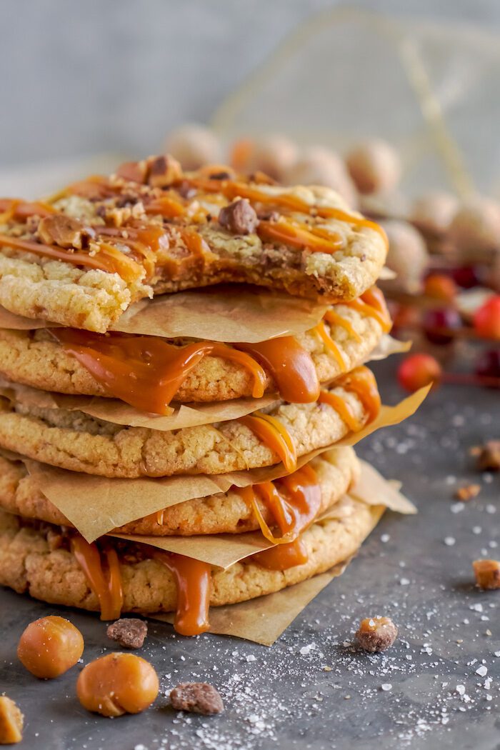 A stack of four caramel pecan cookies.