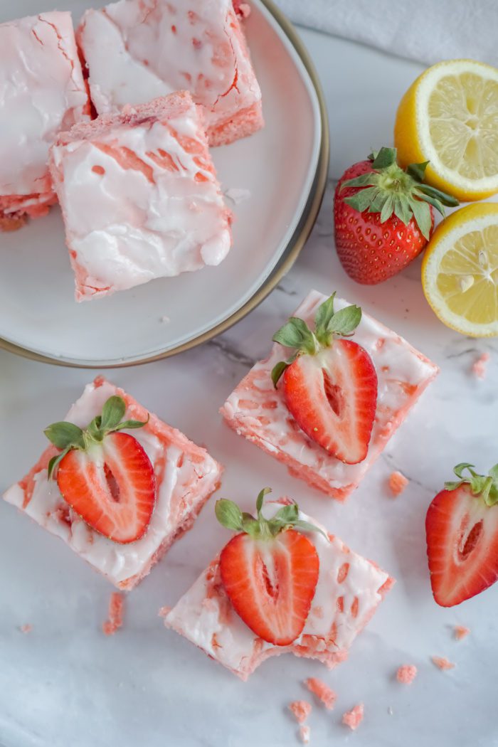 Strawberry lemon squares with icing on top.