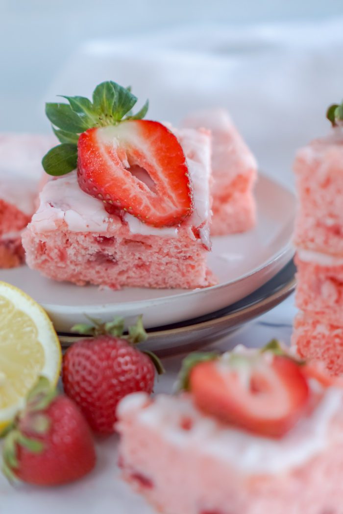 A close-up image of strawberry lemon squares on a plate.