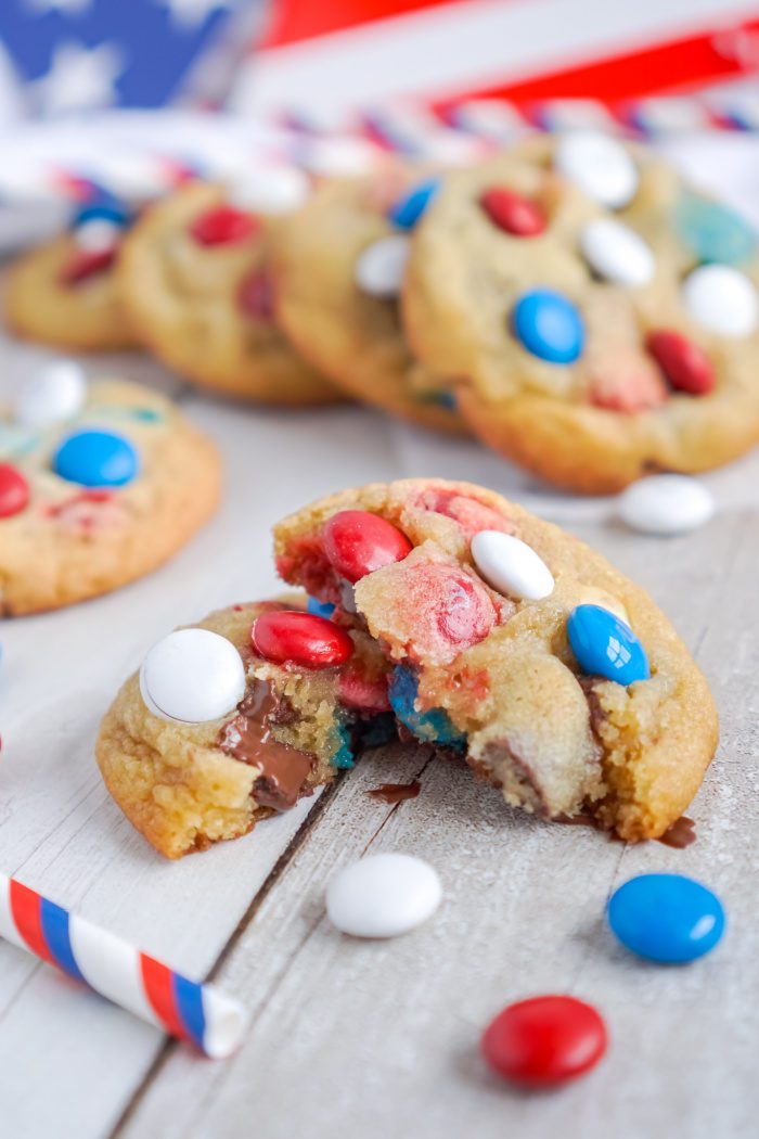 A broken cookie with red, white, and blue candies.