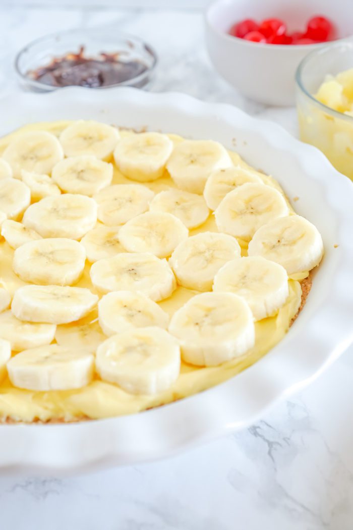 Banana slices arranged on top of a creamy custard filling.