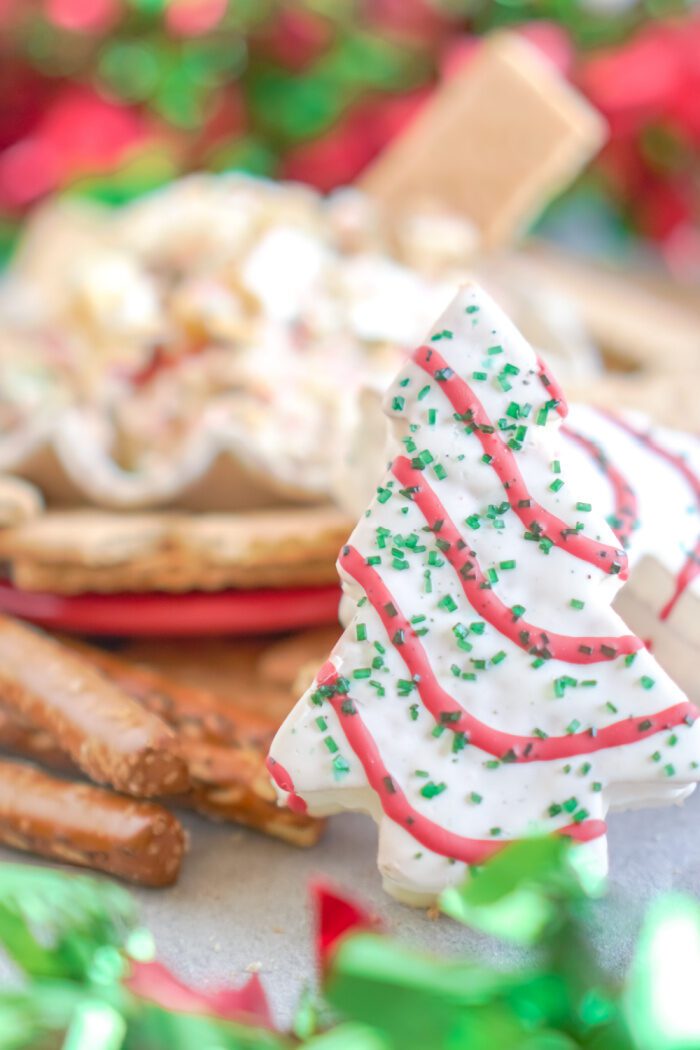 Close up of a Little Debbie Christmas Tree with Cake Dip in the background