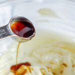 Vanilla being poured into icing