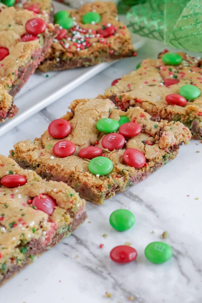 3 Christmas M&M Cookie Bars Lined Up