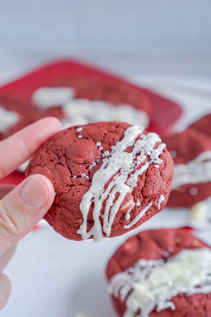 Someone Holding a Red Velvet Cookie