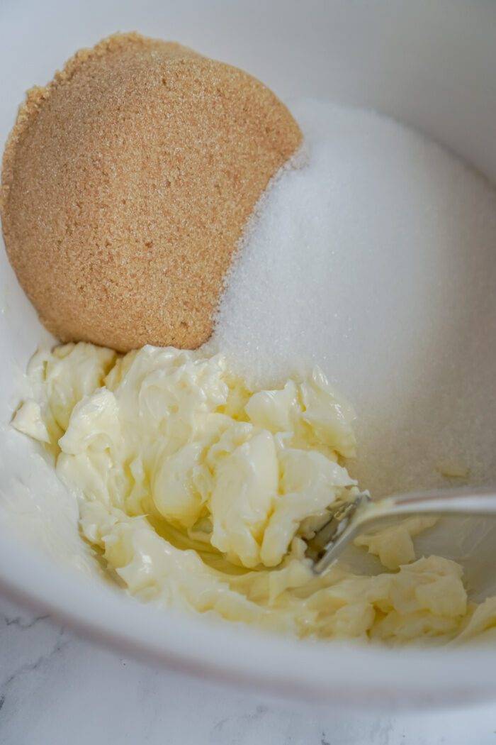 Butter and sugars in mixing bowl