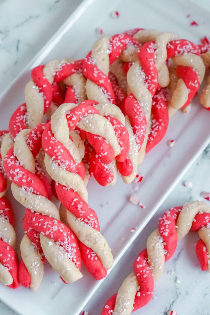 A Bunch of Candy Cane Sugar Cookies on a Plate