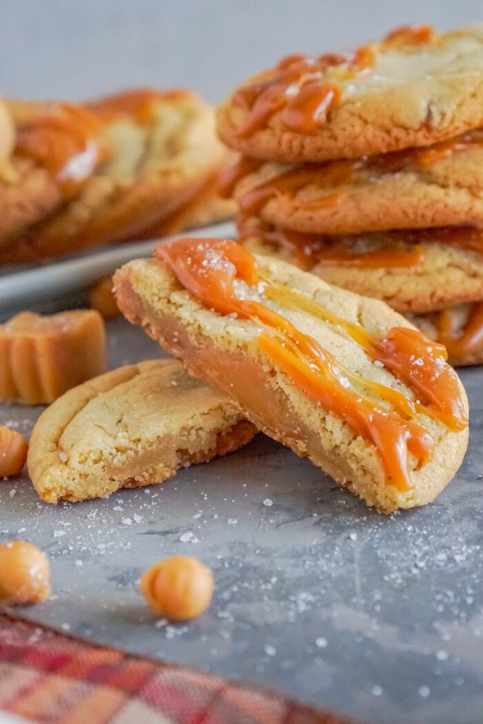 A close-up of a stack of soft caramel cookies.