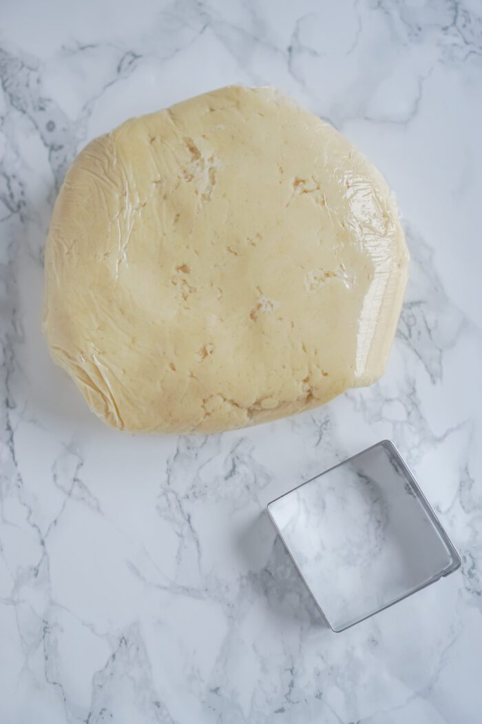 Chilled dough and a square cookie cutter