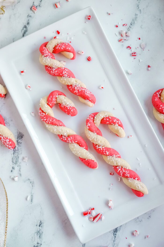3 Candy Cane Sugar Cookies On a Plate