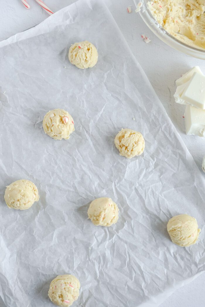 Cookie dough balls on baking sheet