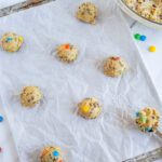 Cookie dough balls on baking sheet