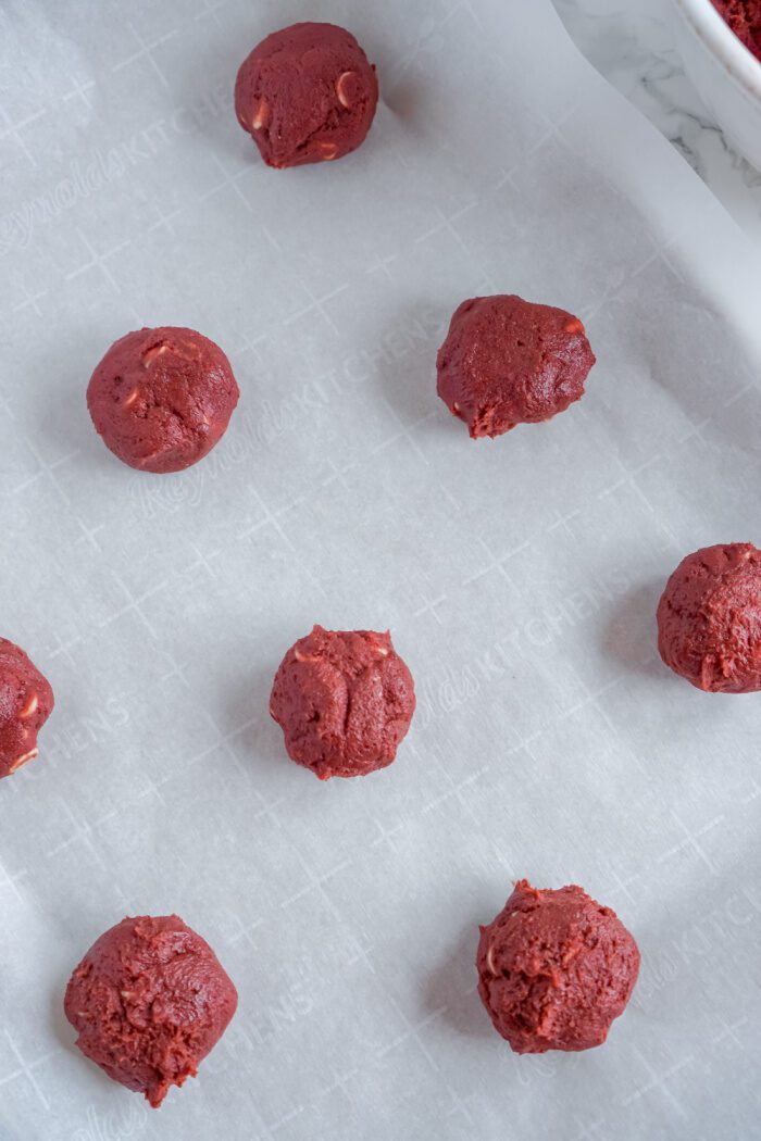 Cookie dough balls on baking sheet