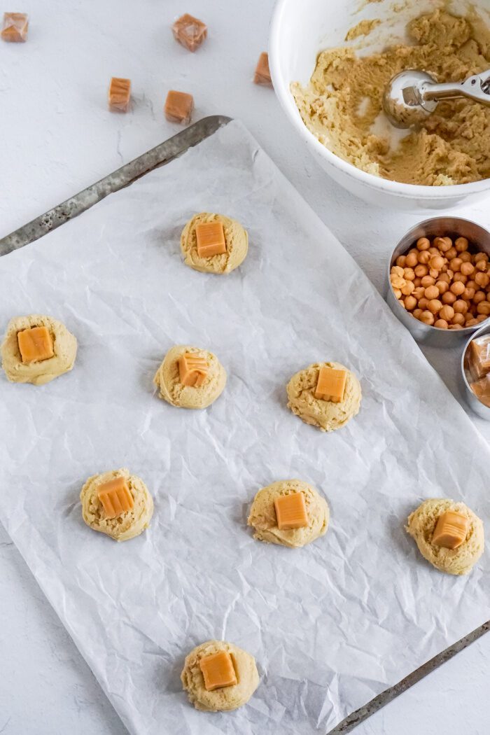 Cookie dough balls with caramel square in the middle