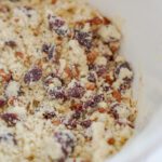 Crumbly cookie dough with cranberries and pecans