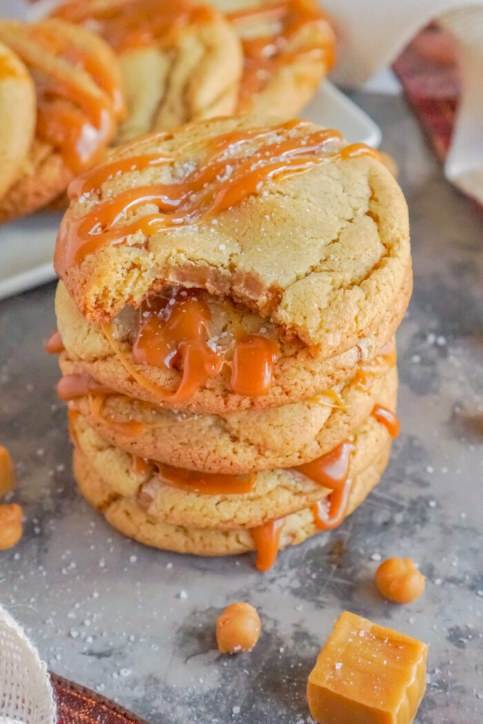 A stack of three soft caramel cookies.