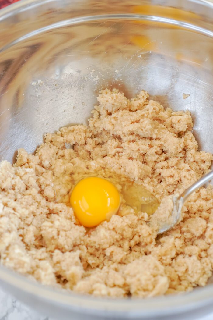 Egg added to mixing bowl