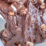 Fudge being poured into prepared pan