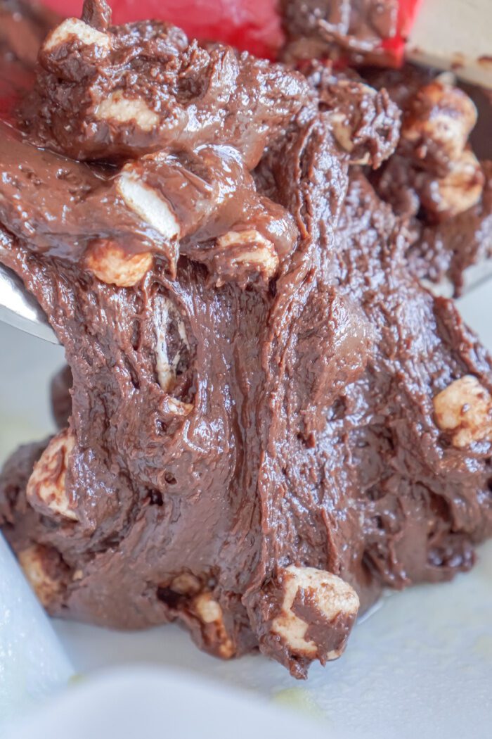 Fudge being poured into prepared pan