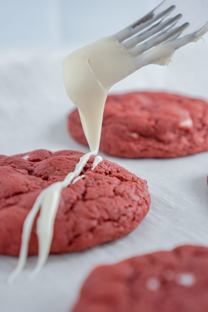 Icing being drizzled on cookie